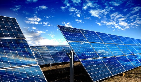 Solar panels modules and blue sky with clouds